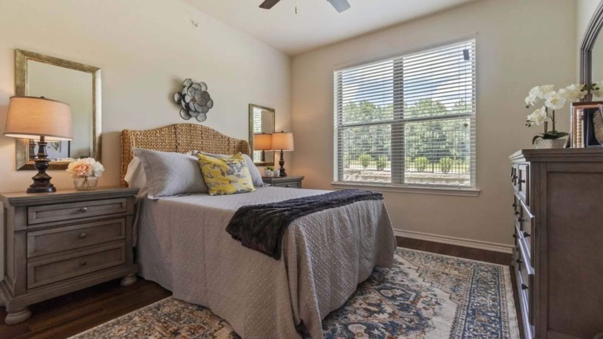 a bedroom with a large bed and a ceiling fan at The Auberge of Tyler