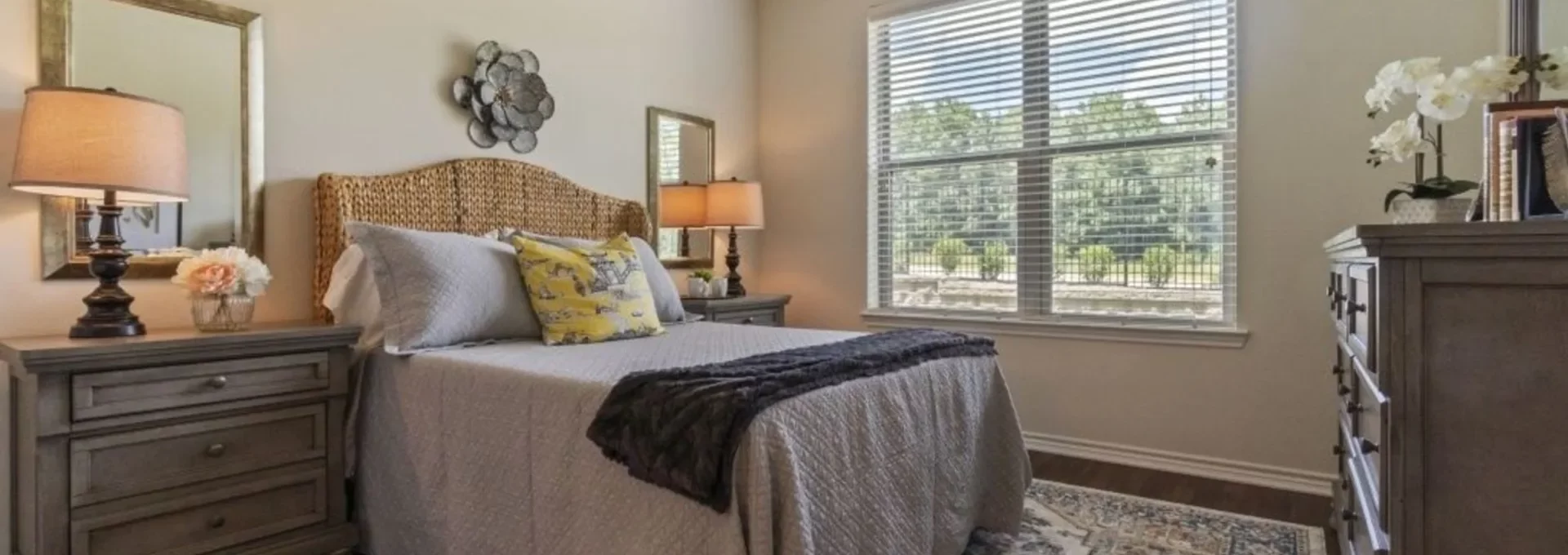 a bedroom with a large bed and a ceiling fan at The Auberge of Tyler