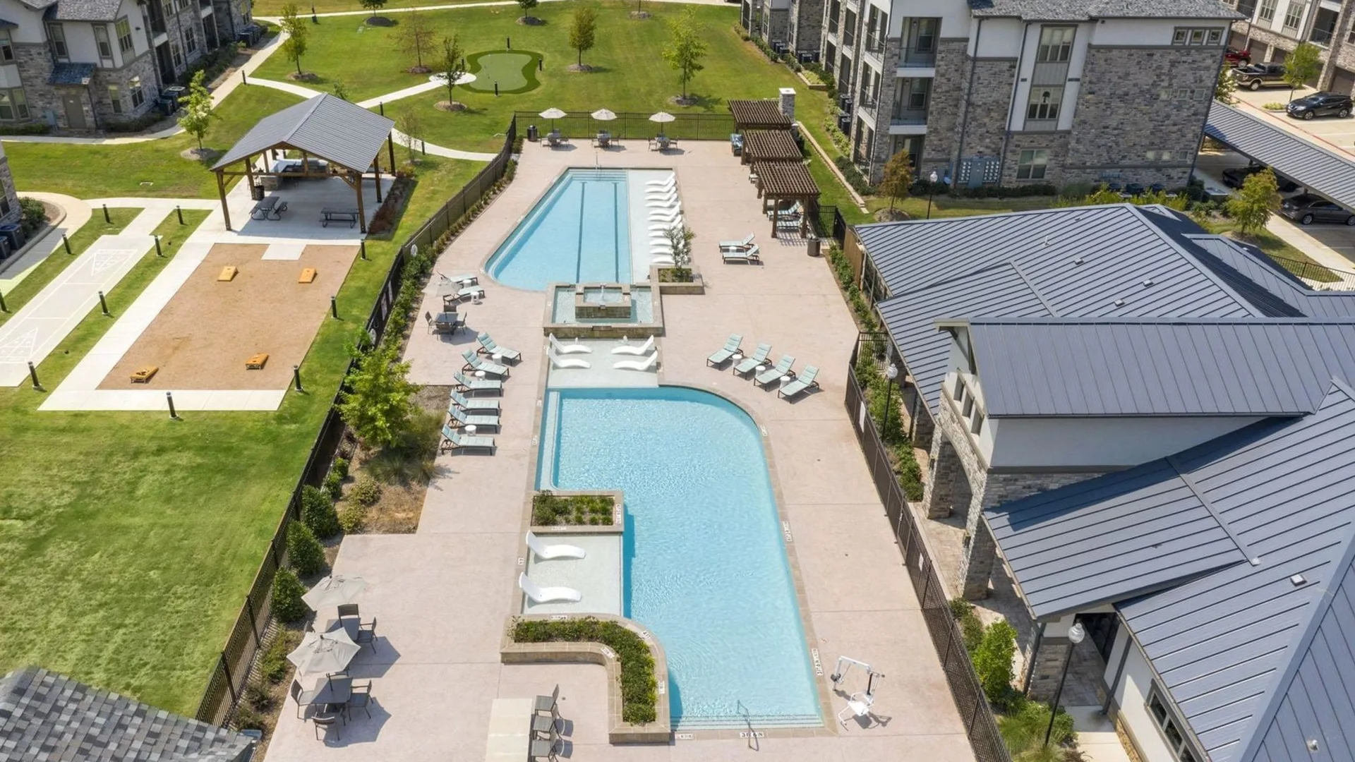 an aerial view of the pool and lawn at The Auberge of Tyler