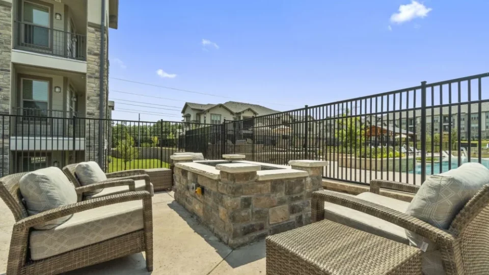 patio with fire pit and chairs at The Auberge of Tyler