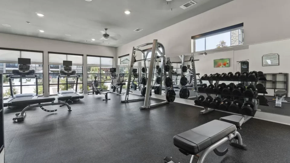 a gym room with weights, treads and other equipment at The Auberge of Tyler