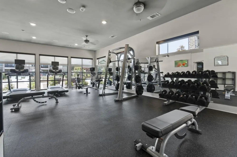 a gym room with weights, treads and other equipment at The Auberge of Tyler