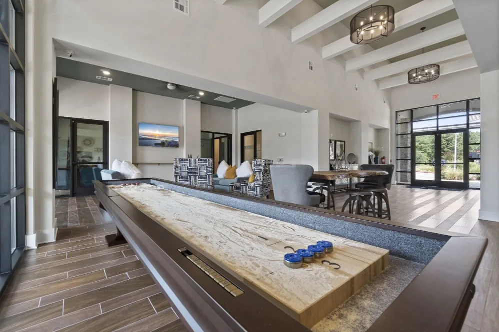 a large game room with a pool table and a bar at The Auberge of Tyler