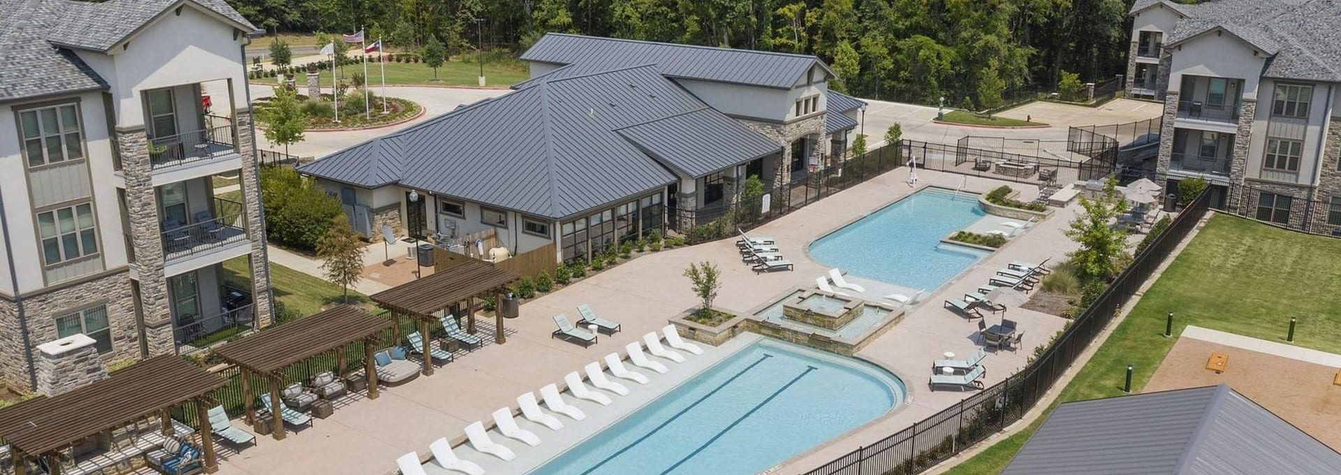 an aerial view of the pool and patio at The Auberge of Tyler